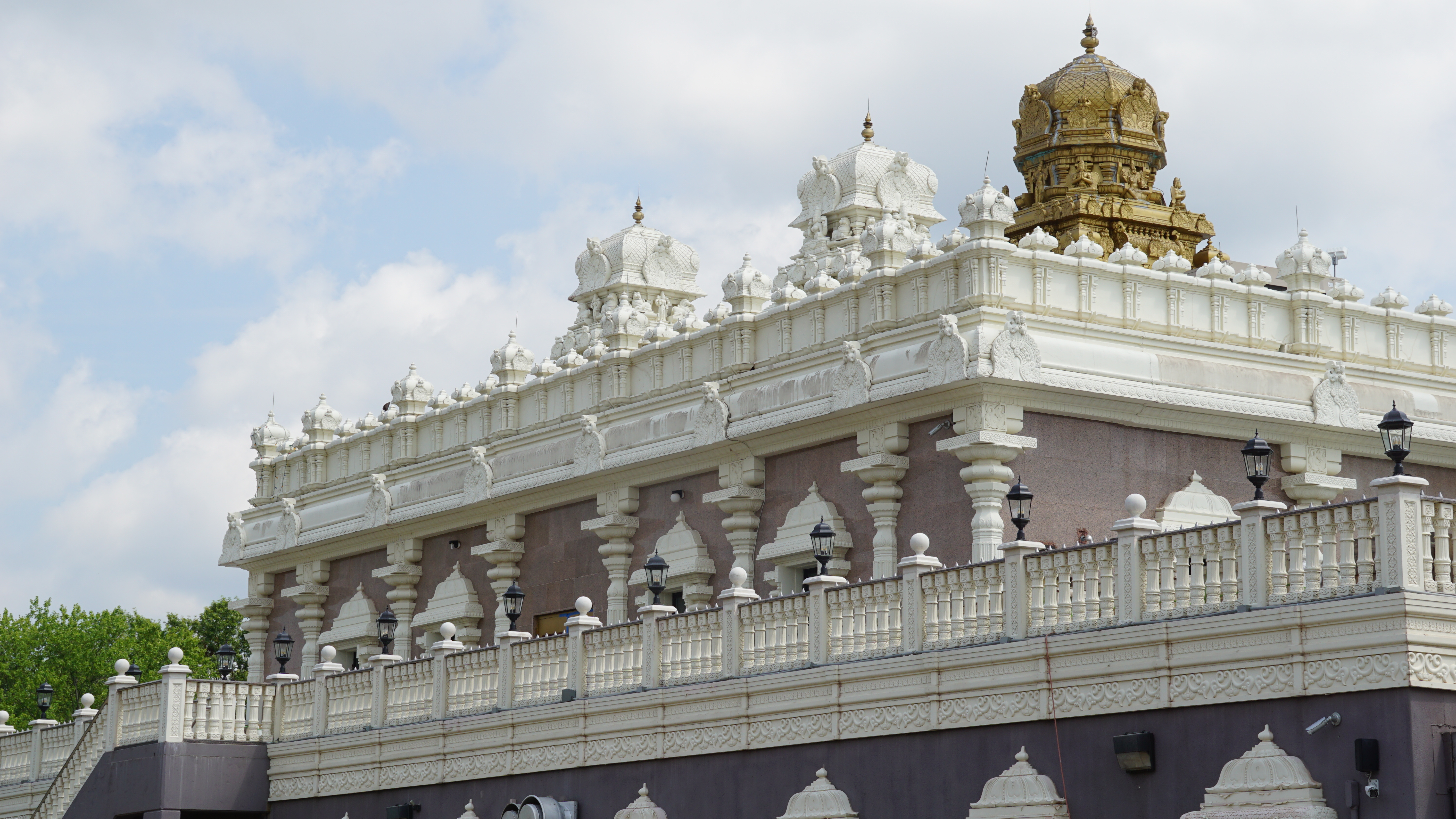 Ornate lavender building with elaborite white trim