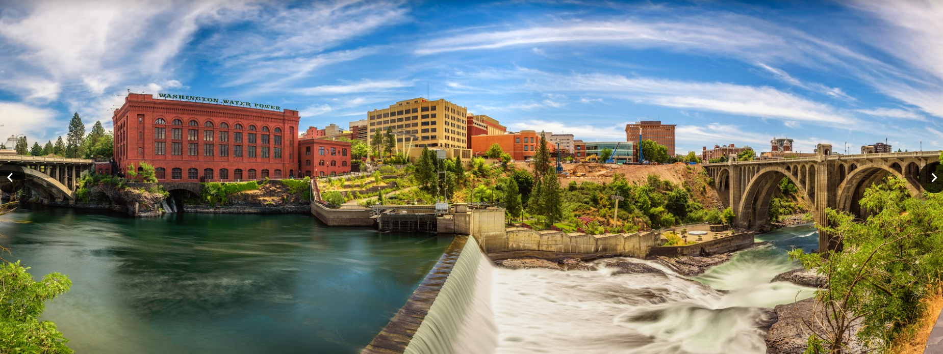 Washington Water Power building and the Monroe Street Bridge along the Spokane river, in Spokane, Washington