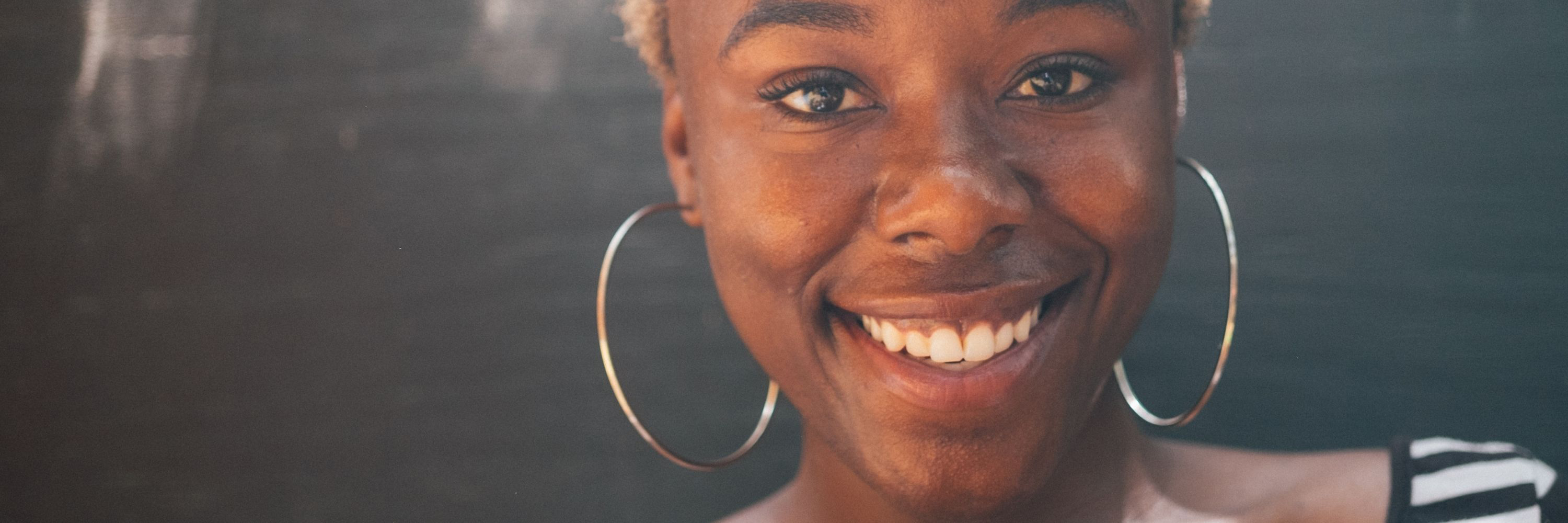 African-American teacher smiling at the camera