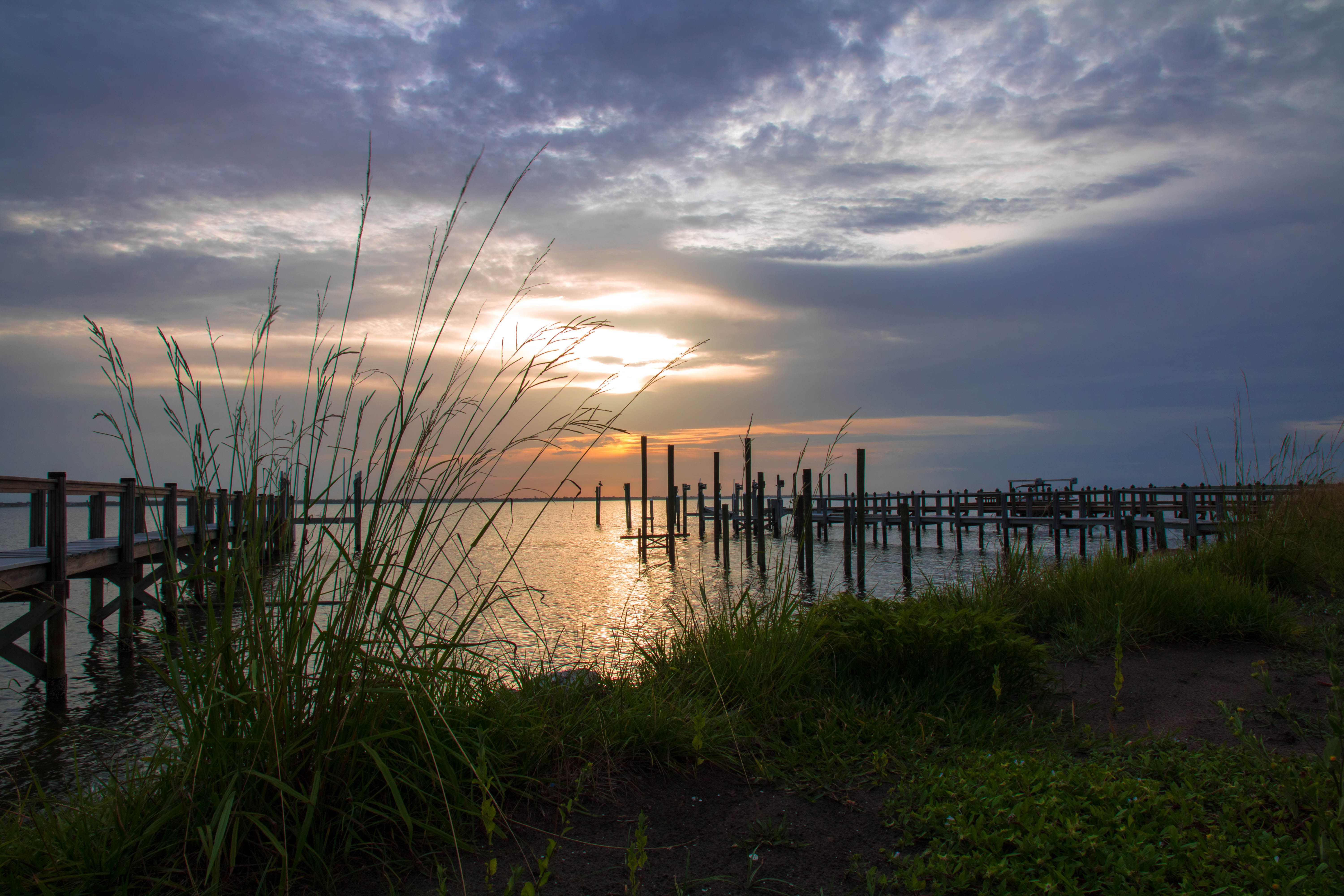 Pier and water at sunrise