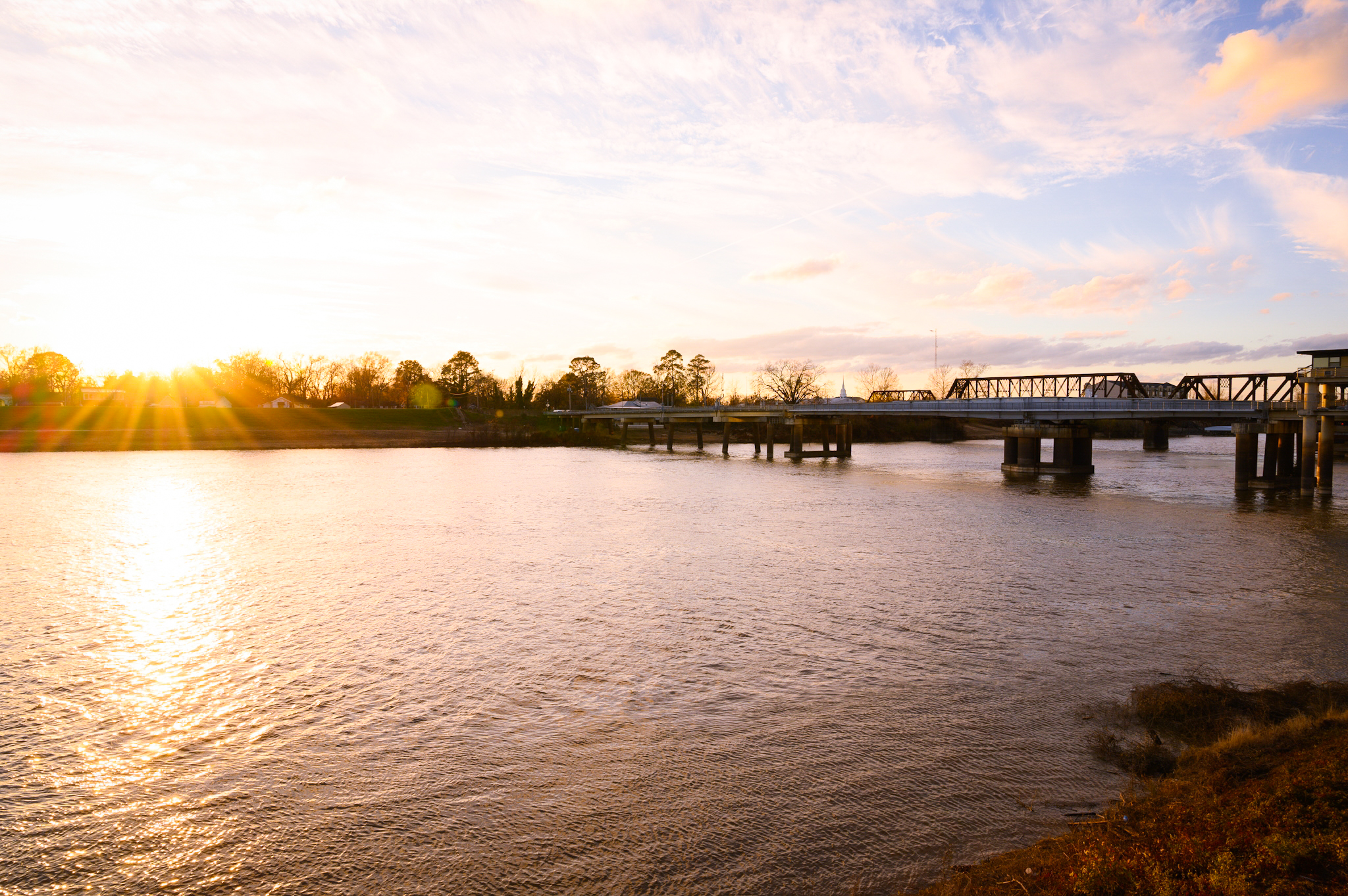 Bridge over water at sunset