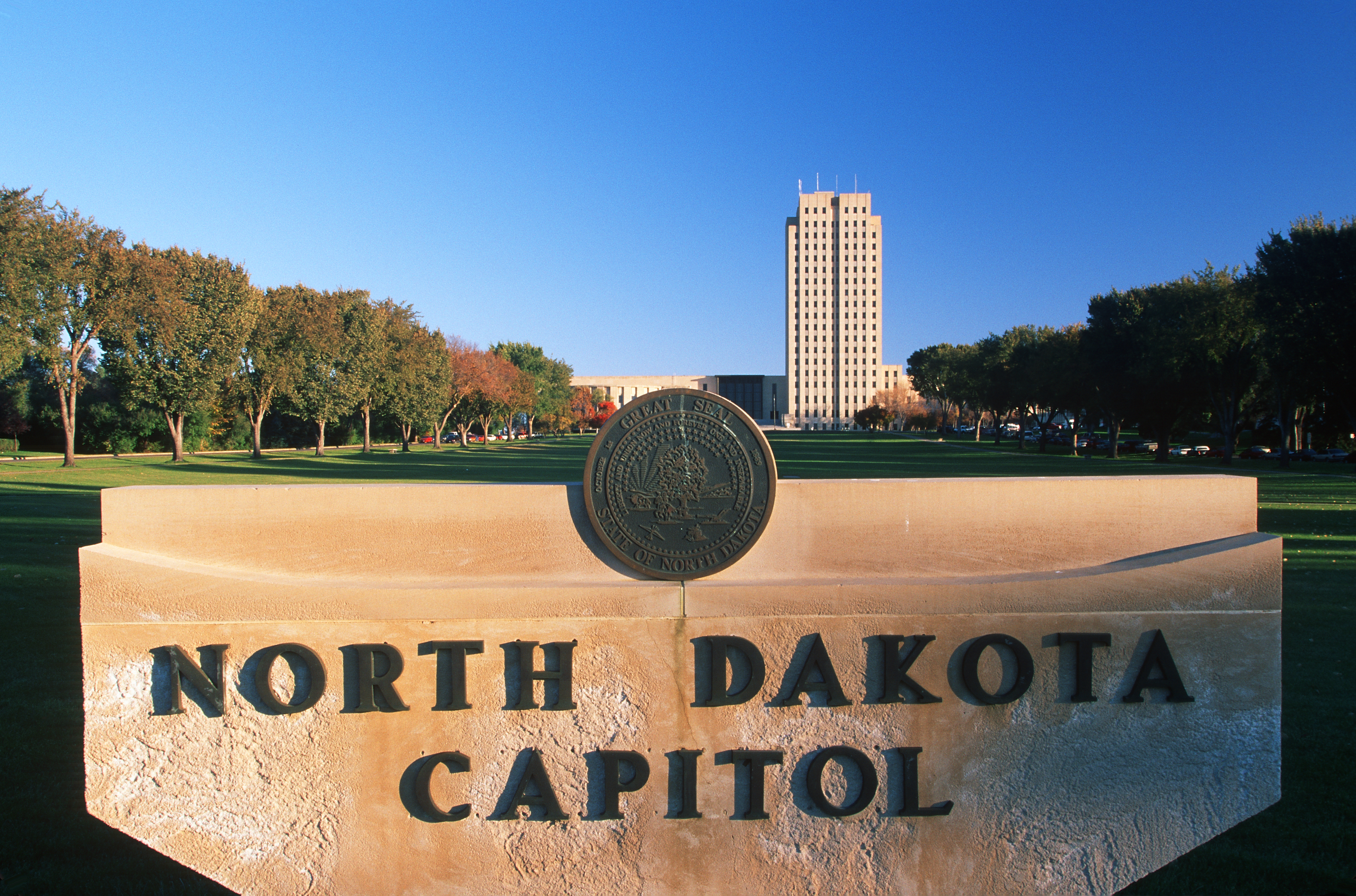 Sign of North Dakota capitol with the Capitol building in the background
