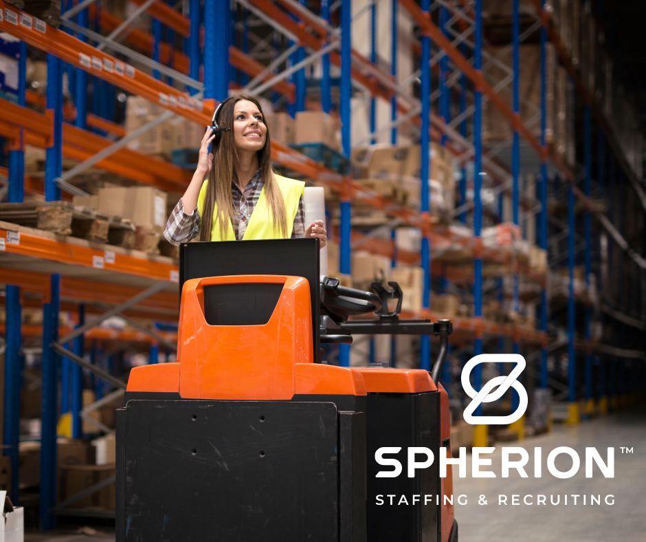 Woman warehouse associate driving an orange forklift