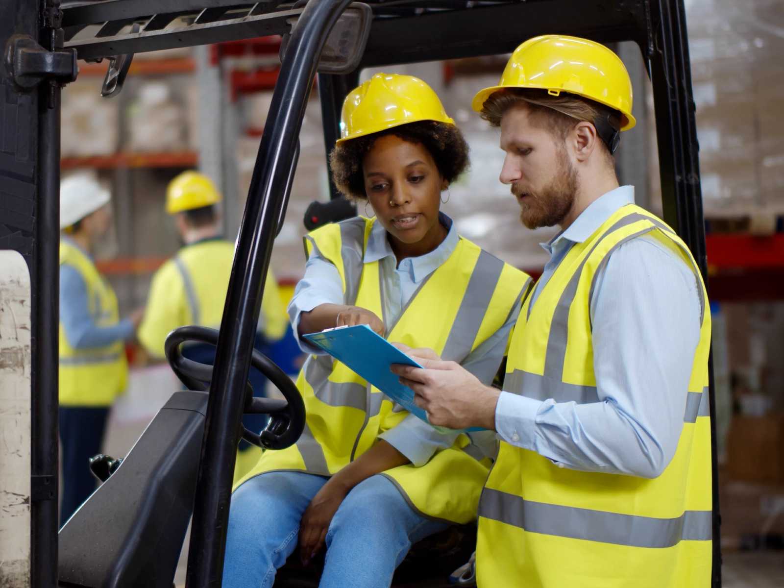 Woman-and-man-working-together-as-forklift-operators