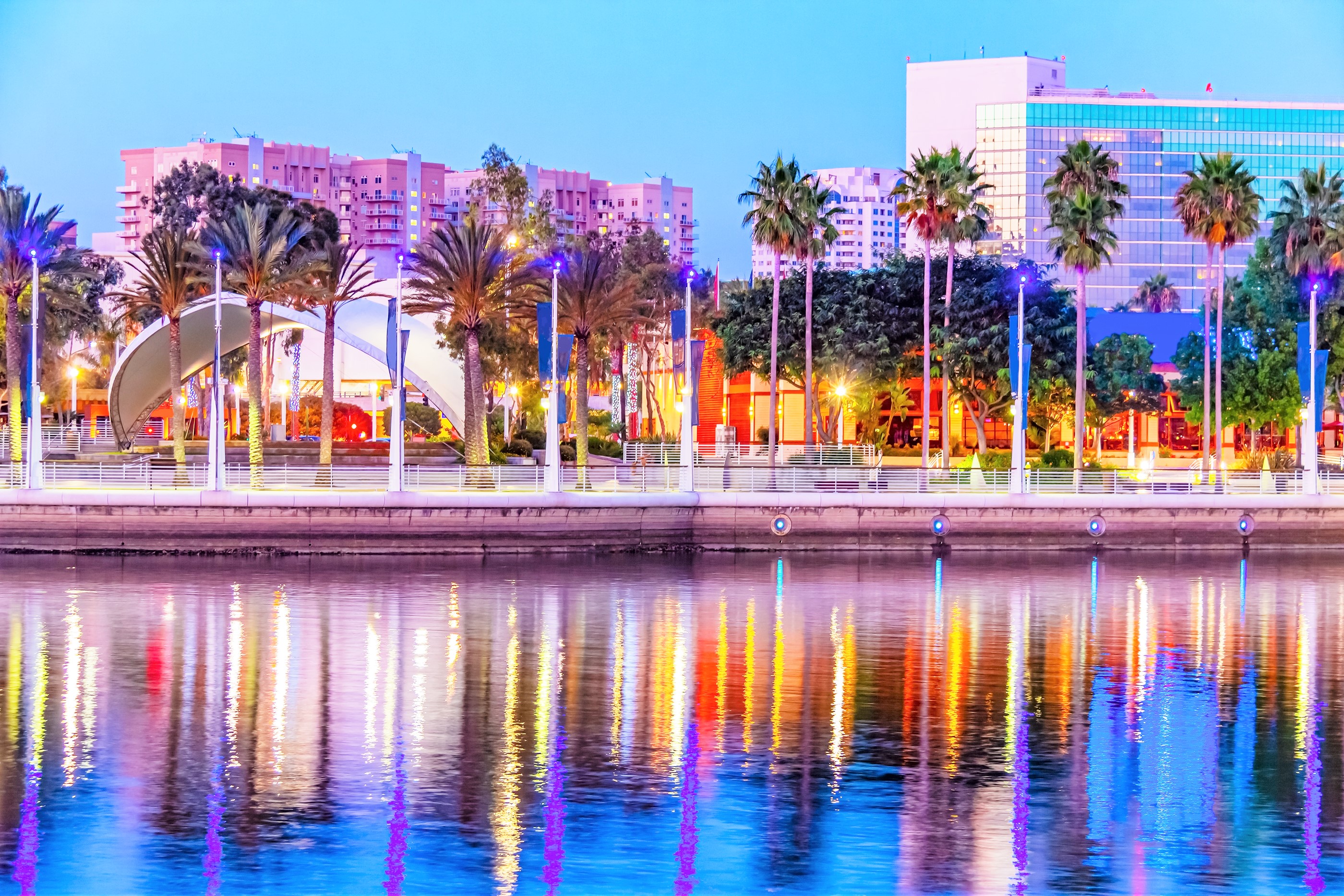 Long Beach, California skyline is reflected in the still water
