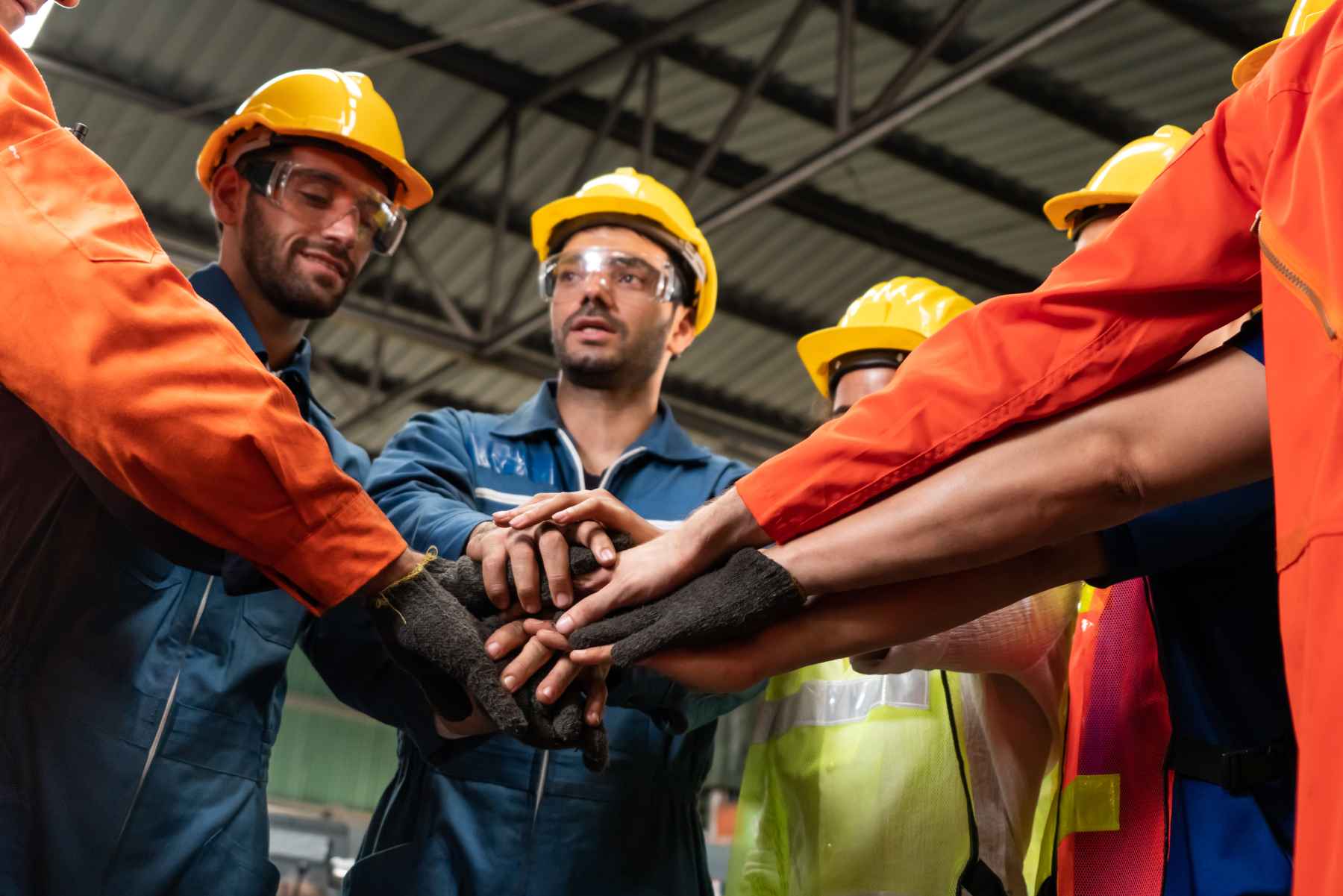 General-laborer-team-huddle-hardhats