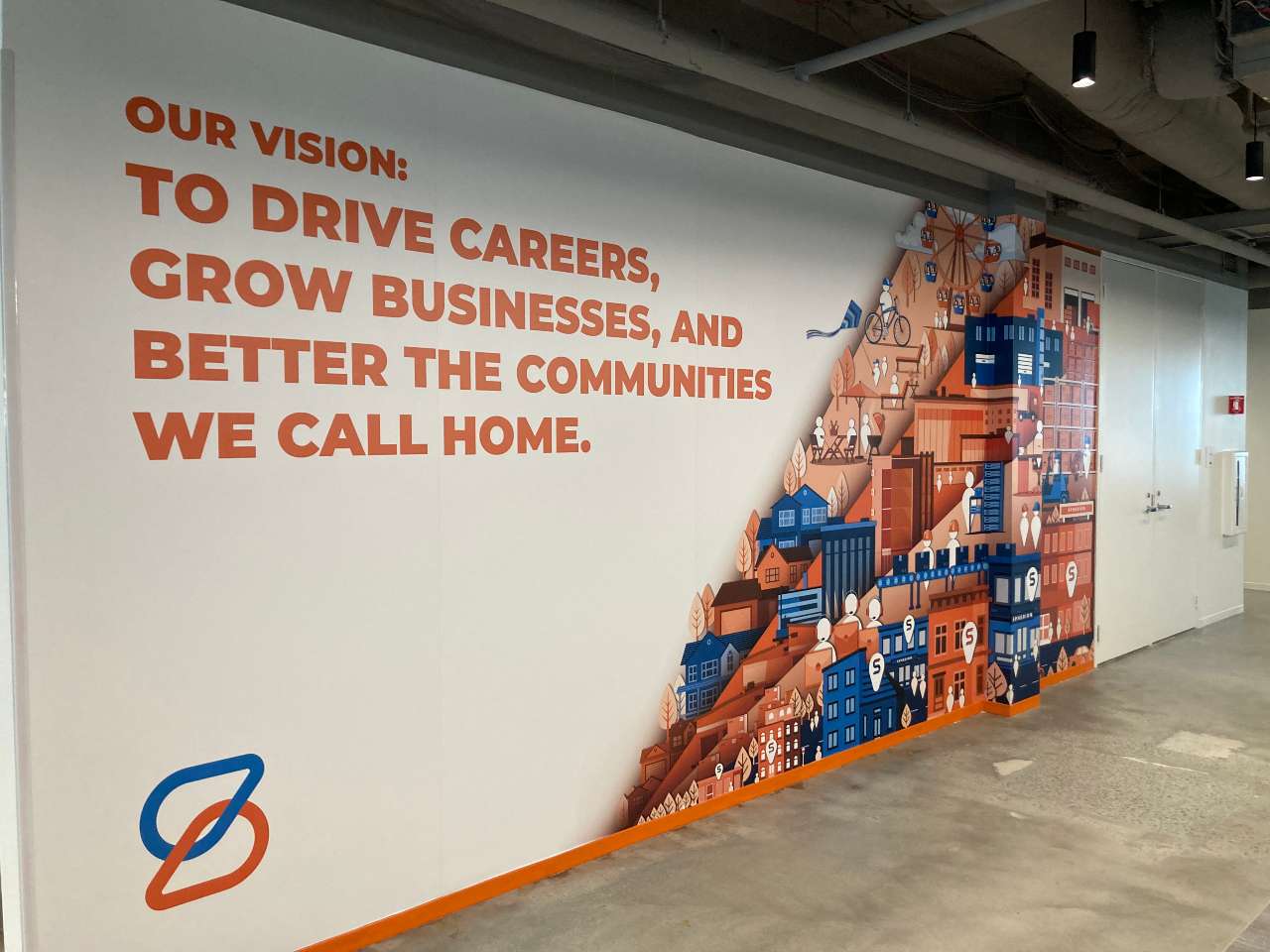 Spherion Field Service Center. Text on wall reads Our vision: To Drive Careers, Grow Business, and Better the Communities We Call Home.