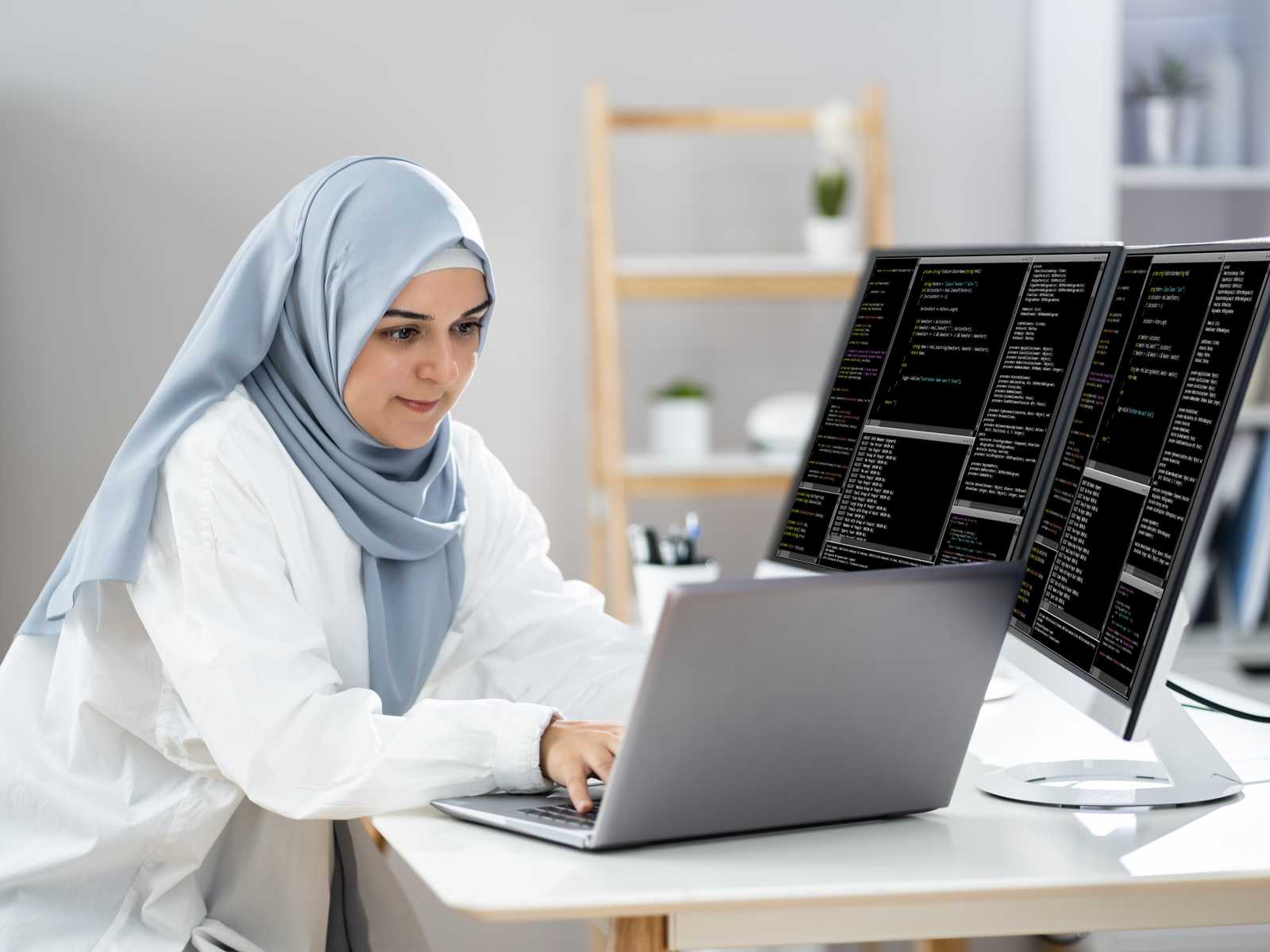 Woman_in_hijab_working_as_a_web_developer