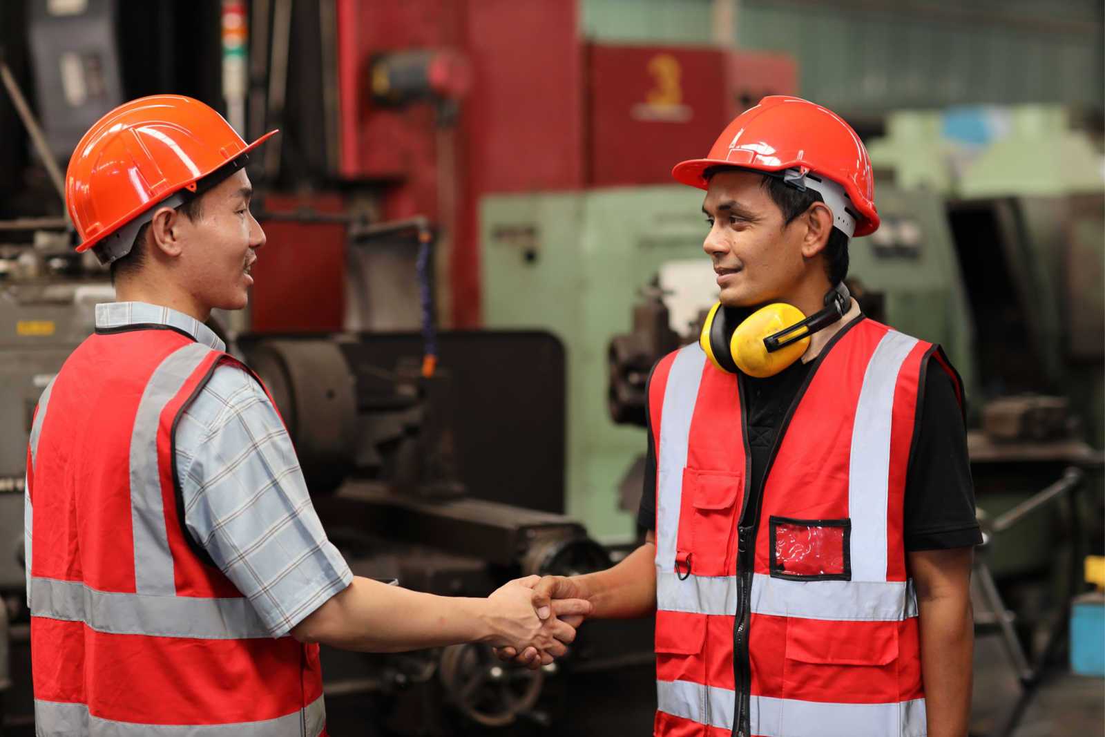 Maintenance_Supervisors_shaking_hands_wearing_orange_safety_vests