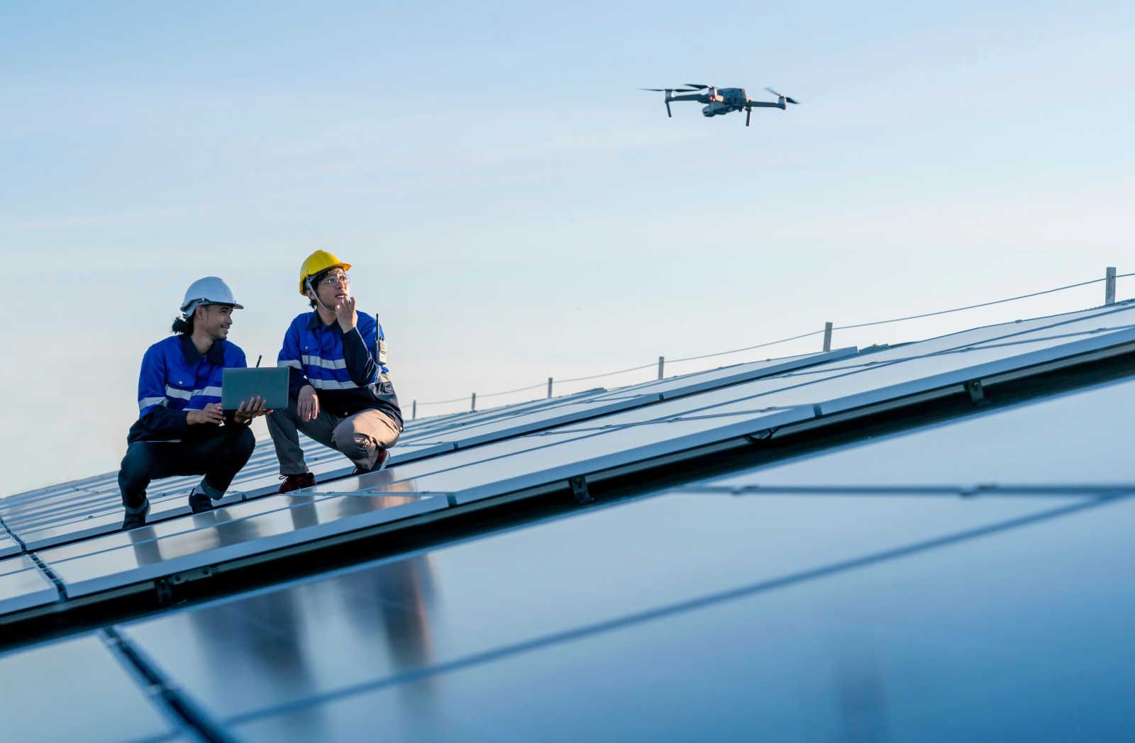 Technicians_working_with_a_drone_on_solar_panels