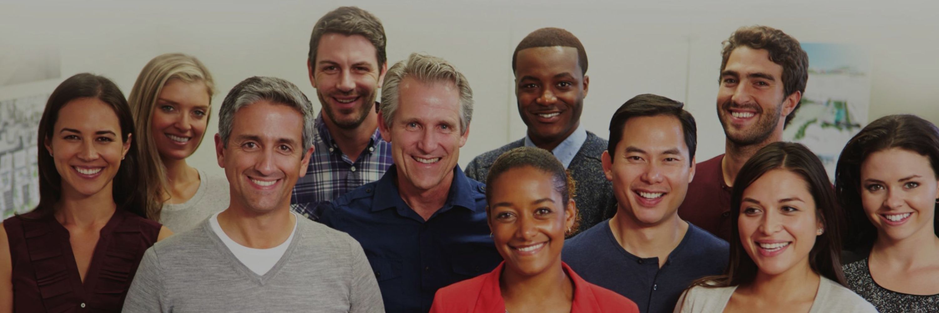 Group of diverse adults smiling at the camera