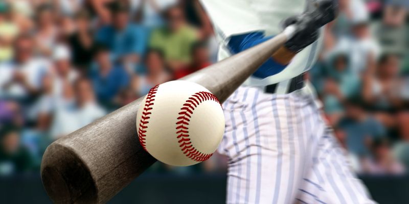 Baseball connecting with a baseball bat