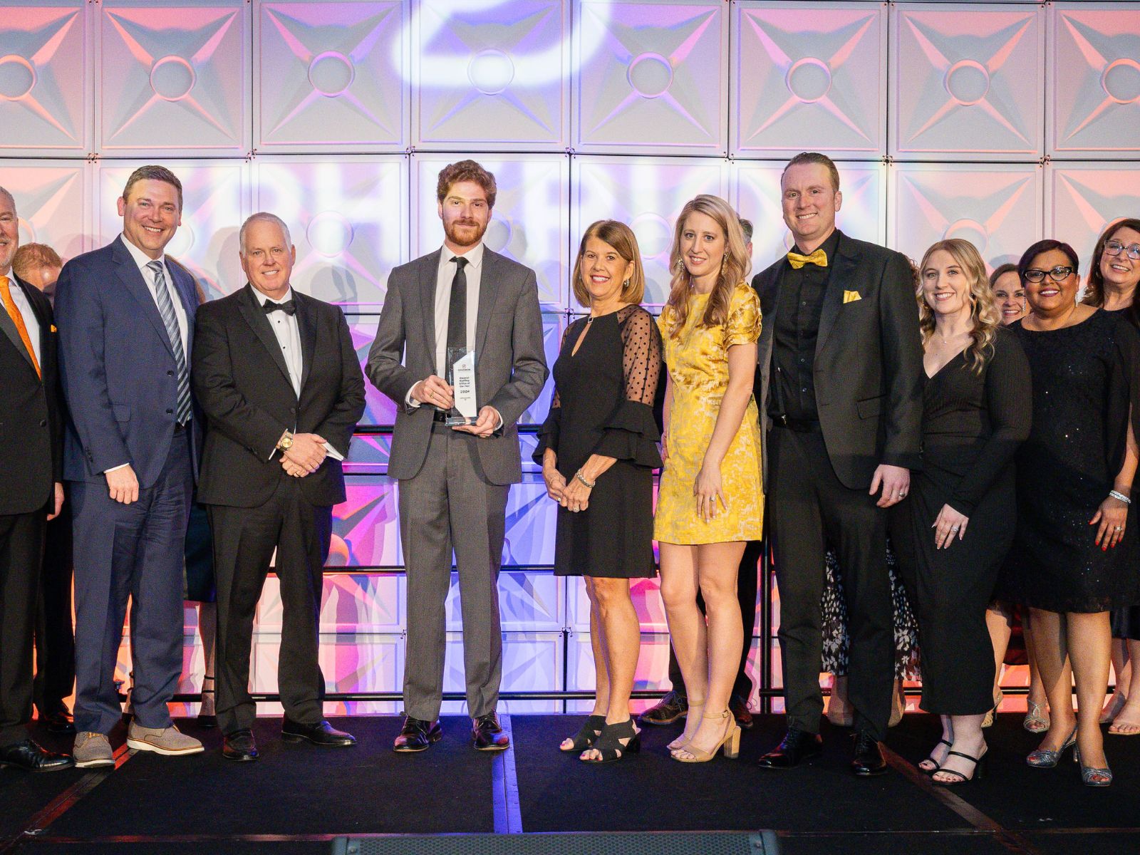 A grop of Spherion professionals on stage to accept an award