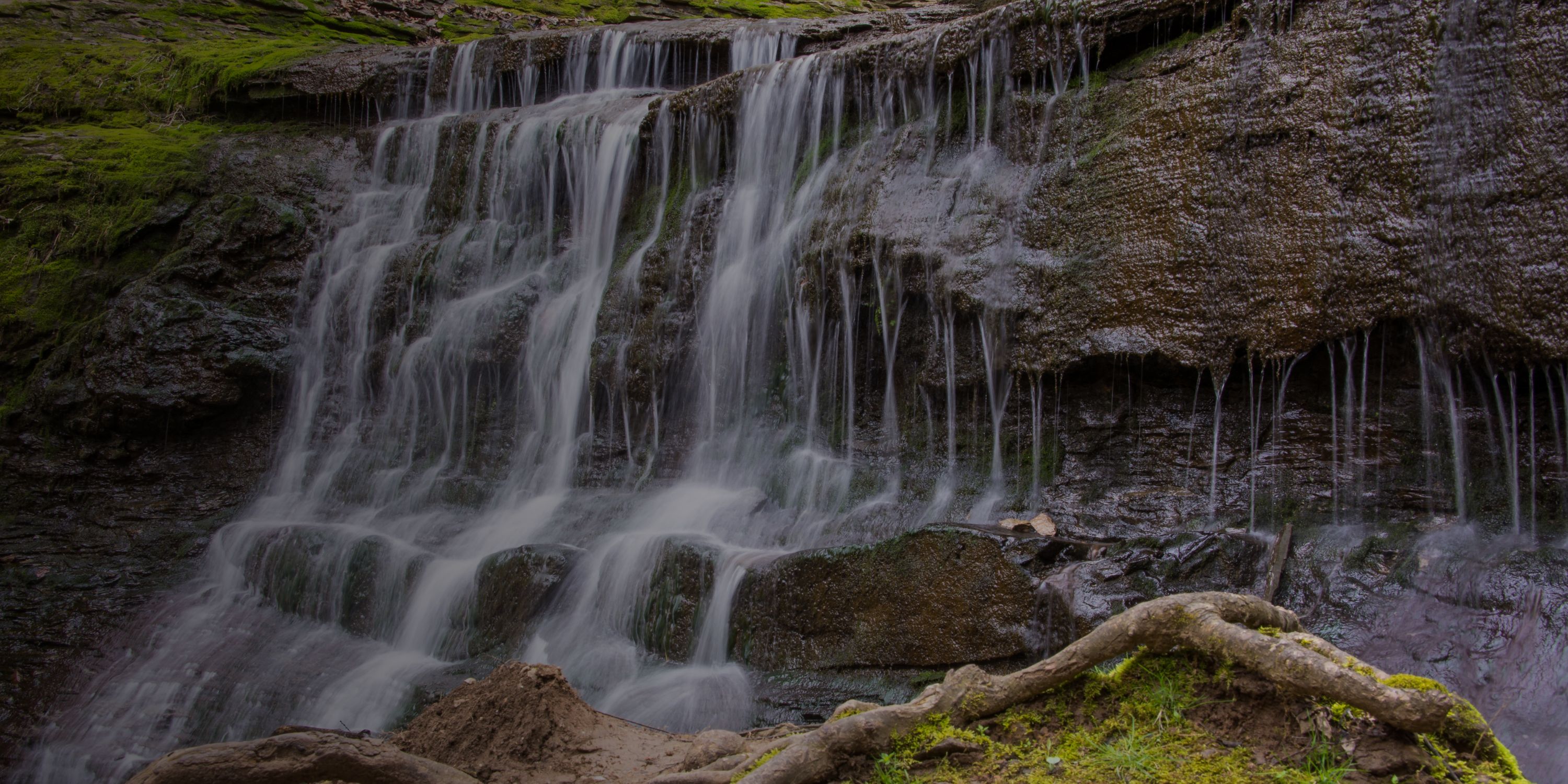 A waterfall flowing down a cliff face