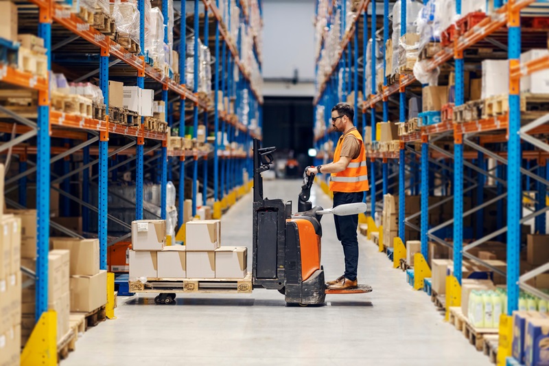Man on forklift in warehouse