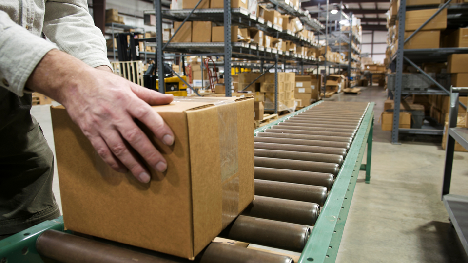 Conveyor belt with cardboard box