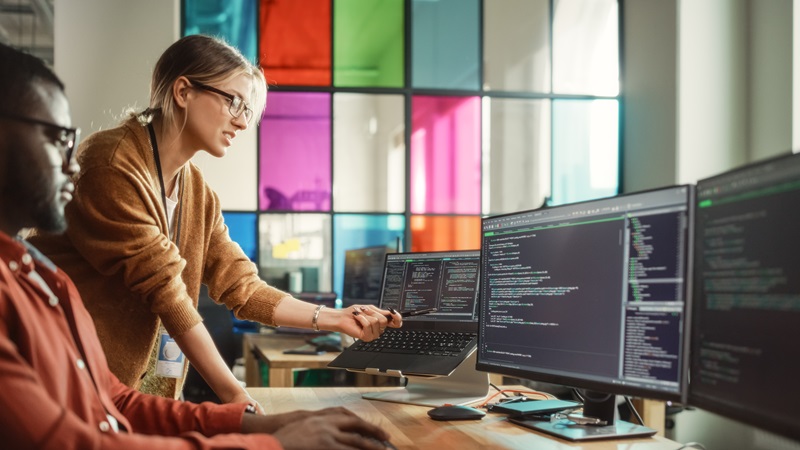 Office workers looking at data
