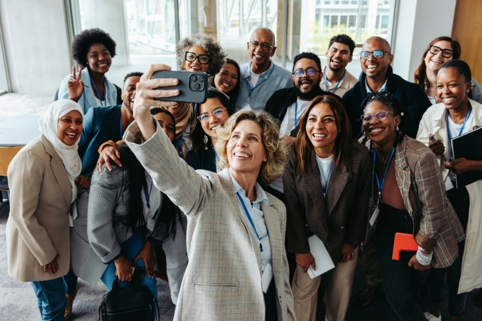 A group of professionals taking a selfie