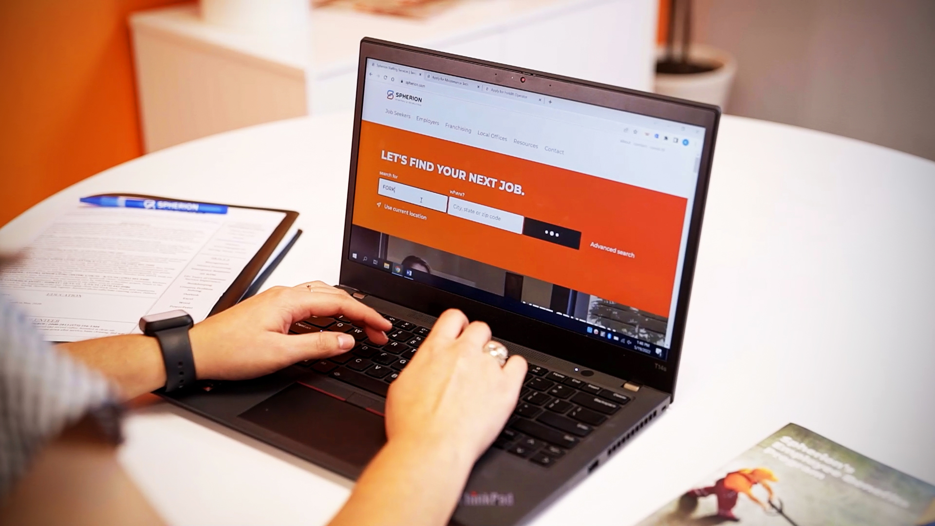 Build a Winning Franchise Marketing Strategy A woman typing on a laptop