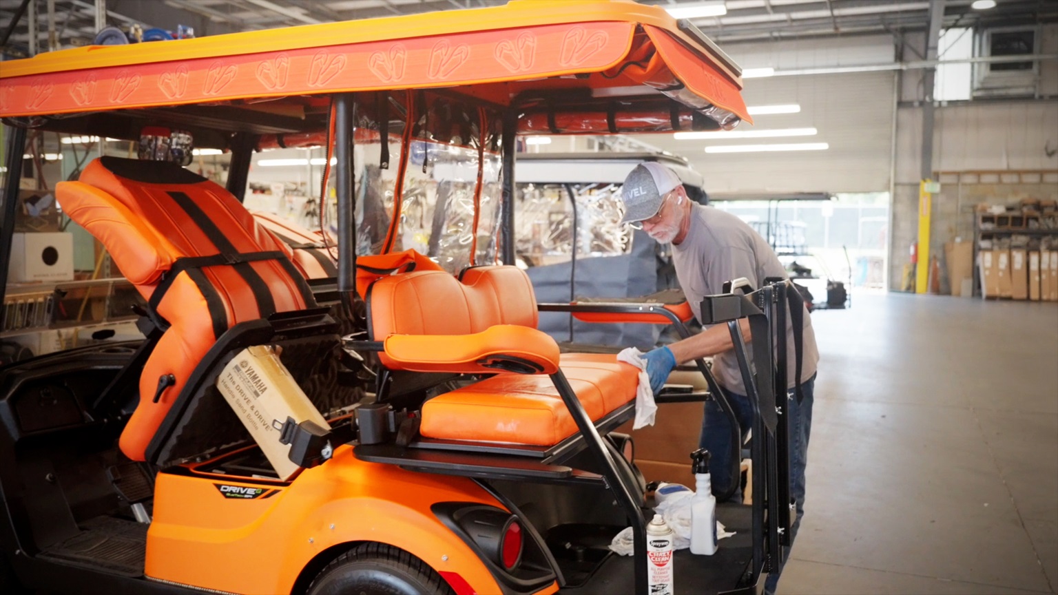 Final touches on a golf cart