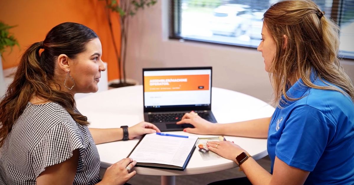 Two women talking about finding a job with a Spherion recruiter