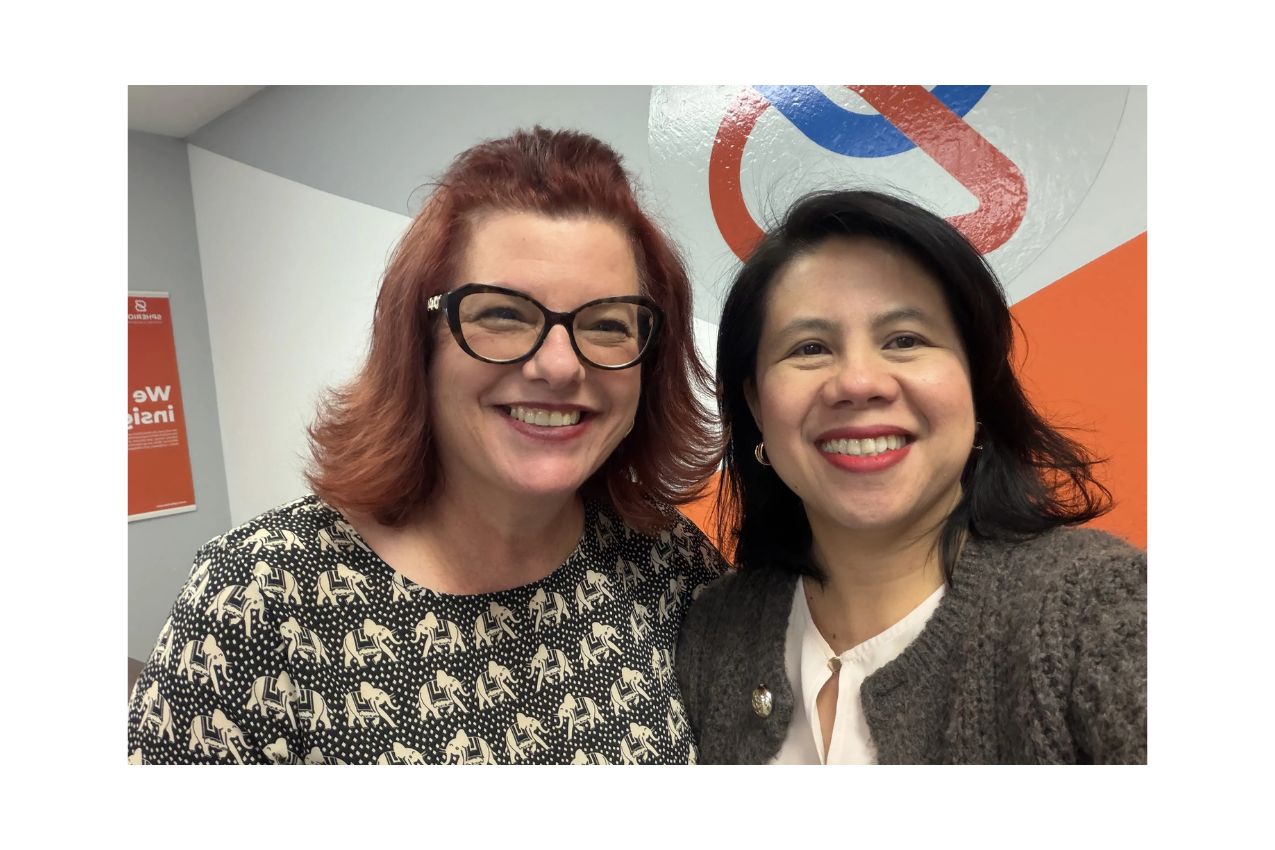 Two smiling women in a Spherion office