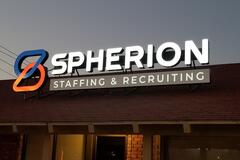 Spherion sign outside the Wichita Falls, TX office against a twilight sky