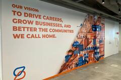 Spherion Field Service Center. Text on wall reads Our vision: To Drive Careers, Grow Business, and Better the Communities We Call Home.