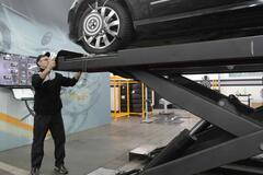 Man_working_as_machinist_on_a_car