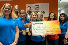 The Spherion North Dartmouth team poses with a check for Friends of Jack