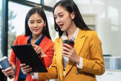 Two businesswomen looking at an iPad