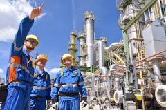 Men working at a refinery