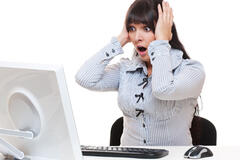 A woman yelling at her desktop computer