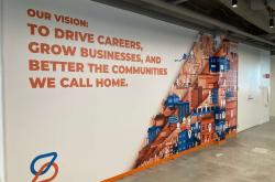 Spherion Field Service Center. Text on wall reads Our vision: To Drive Careers, Grow Business, and Better the Communities We Call Home.