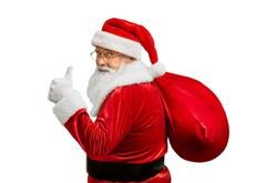 A picture of Santa looking at the camera over his left shoulder and giving a thumbs-up while he holds a red gift bag over his right shoulder.