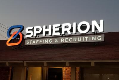 Spherion sign outside the Wichita Falls, TX office against a twilight sky