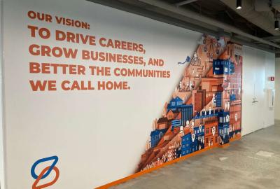 Spherion Field Service Center. Text on wall reads Our vision: To Drive Careers, Grow Business, and Better the Communities We Call Home.