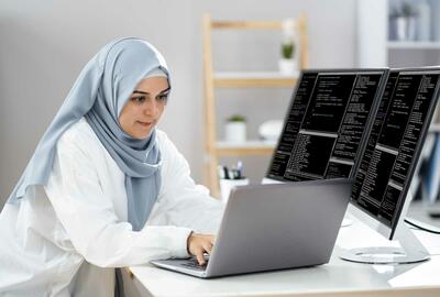 Woman_in_hijab_working_as_a_web_developer