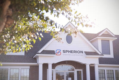 Photo of a Spherion office surrounded by trees and sunlight