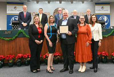 A group of Spherion professionals poses for the camera at the Greater Naples Chamber of Commerce meeting on Dec. 10, 2024