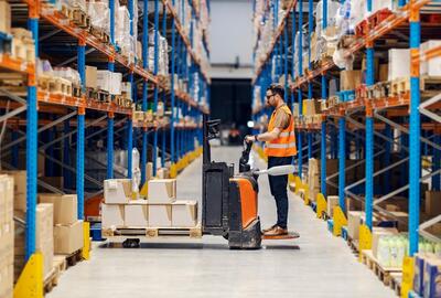 Man on forklift in warehouse