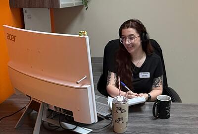 A skilled trades staff recruiter working in an office