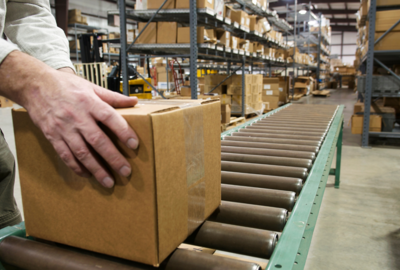 Conveyor belt with cardboard box