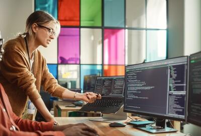 Office workers looking at data