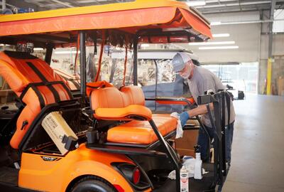 Final touches on a golf cart