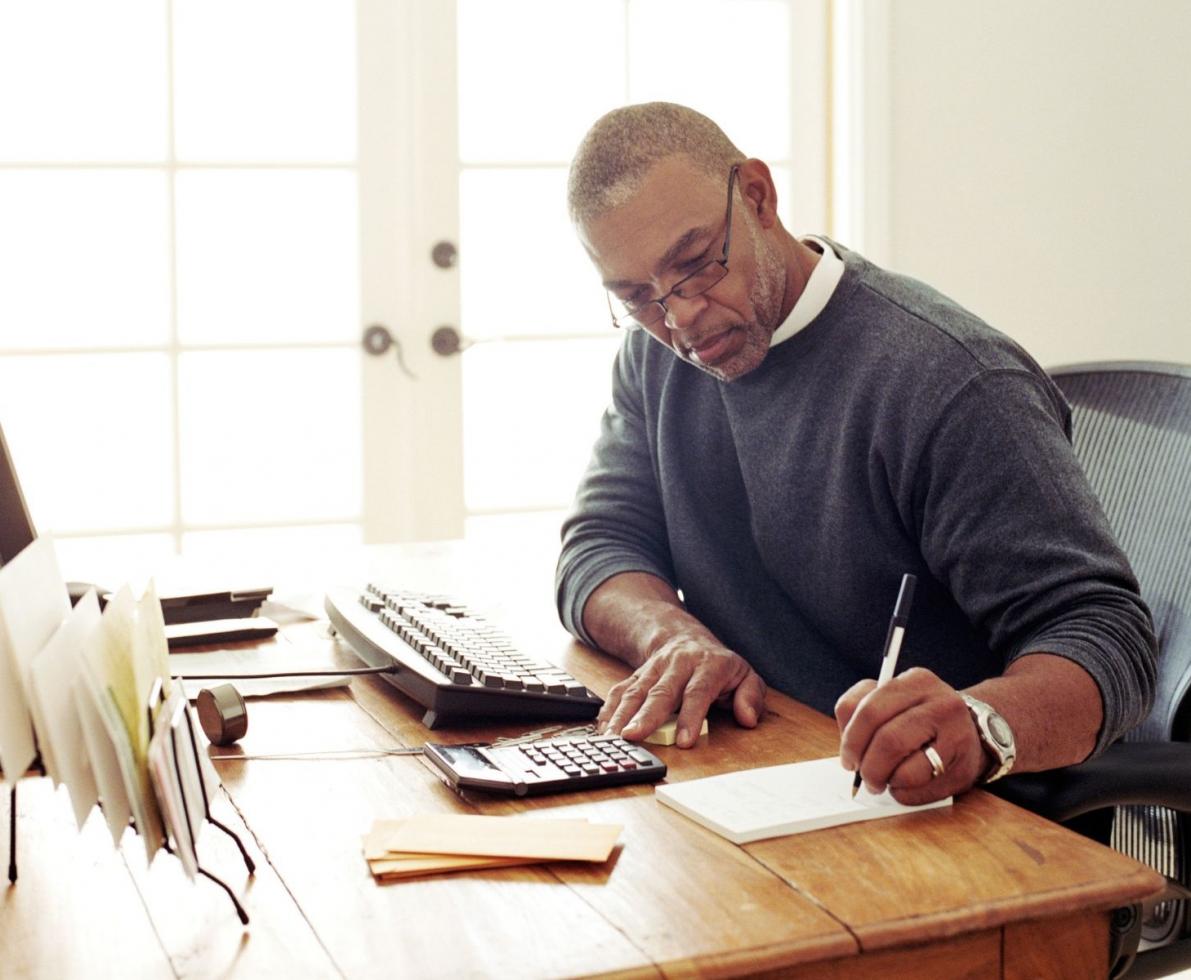 Accountant working on a tax project at a desk