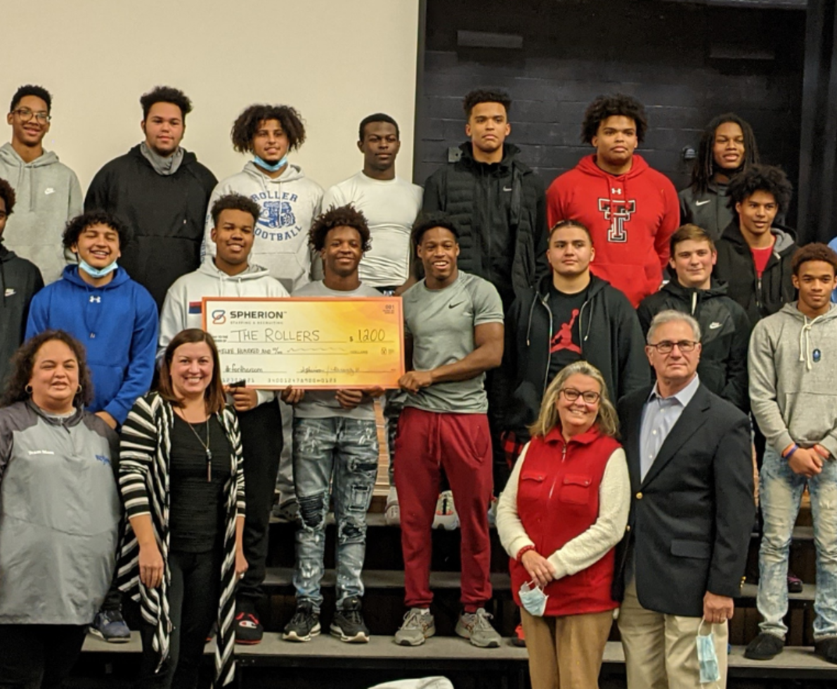 The Spherion Pennsylvania team traveled to Steelton-Highspire Junior-Senior High School to meet the Roller football team and donate $1,200 to their end-of-year celebration and spring seven-on-seven football team fees. The Rollers are a team close to Spherion employee Leane's heart. Leane acts as their football operations coordinator and team mom. 