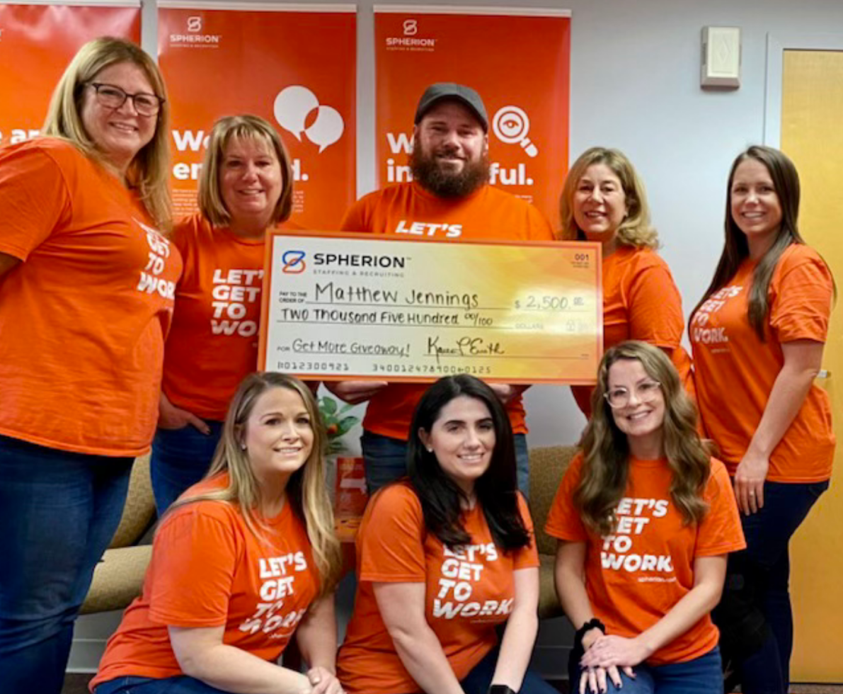 Matthew Jennings poses with his check and members of Spherion's North Dartmouth, Massachusetts office