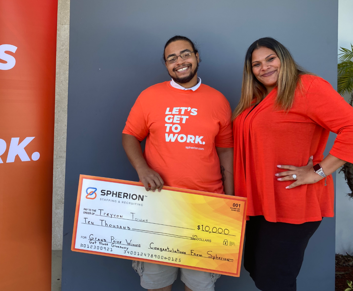 Treyvon Towns poses with his grand prize $10,000 check and Deborah Figueroa, client services specialist at Spherion's Port Saint Lucie, Florida office