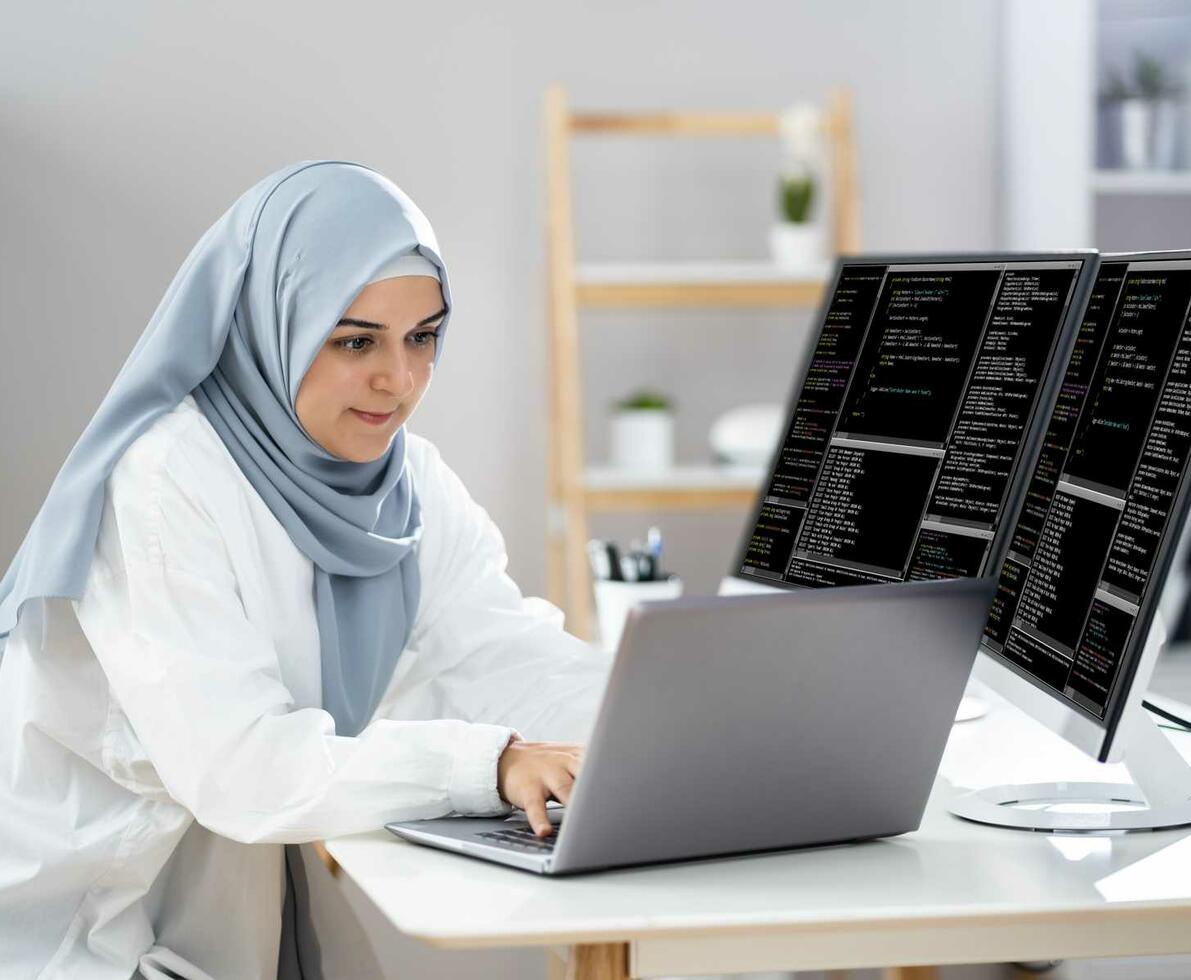 Woman_in_hijab_working_as_a_web_developer